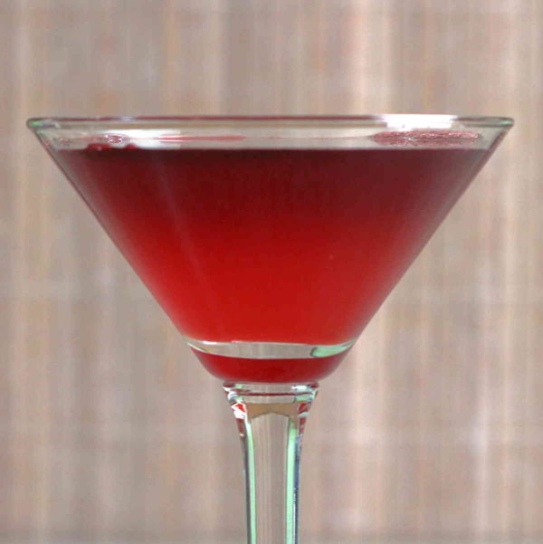 The Crimson Cocktail is unusually sweet for a gin-based cocktail. This recipe features gin and either lemon or lime juice, but adds to those a combined ounce of grenadine and port.