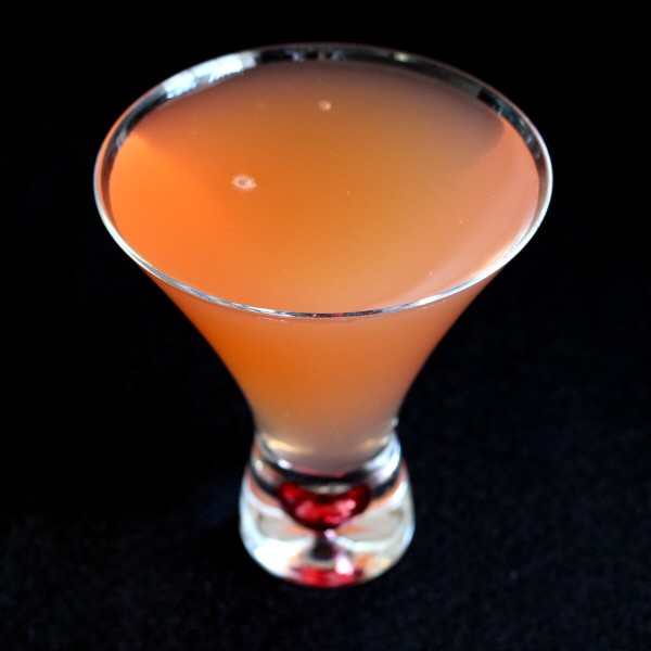 The Peking Cocktail is a rum based drink with a hint of anise flavor. That's the Pernod, a liqueur flavored with Chinese star anise. With grenadine lemon juice, it becomes a very refreshing cocktail.