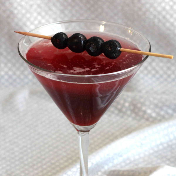 The delicious, fruity Berry Fusion Martini drink recipe blends the tastes of blackcurrant and cranberry with the tropical fruit flavors of Hpnotiq liqueur. It's tart and sweet, with a taste that's endlessly fascinating.